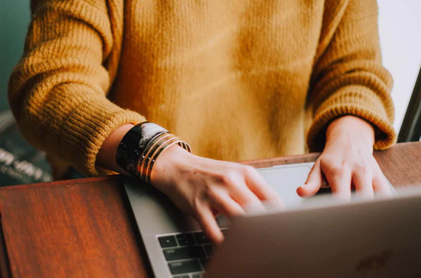 Person looking for social work jobs on a laptop.