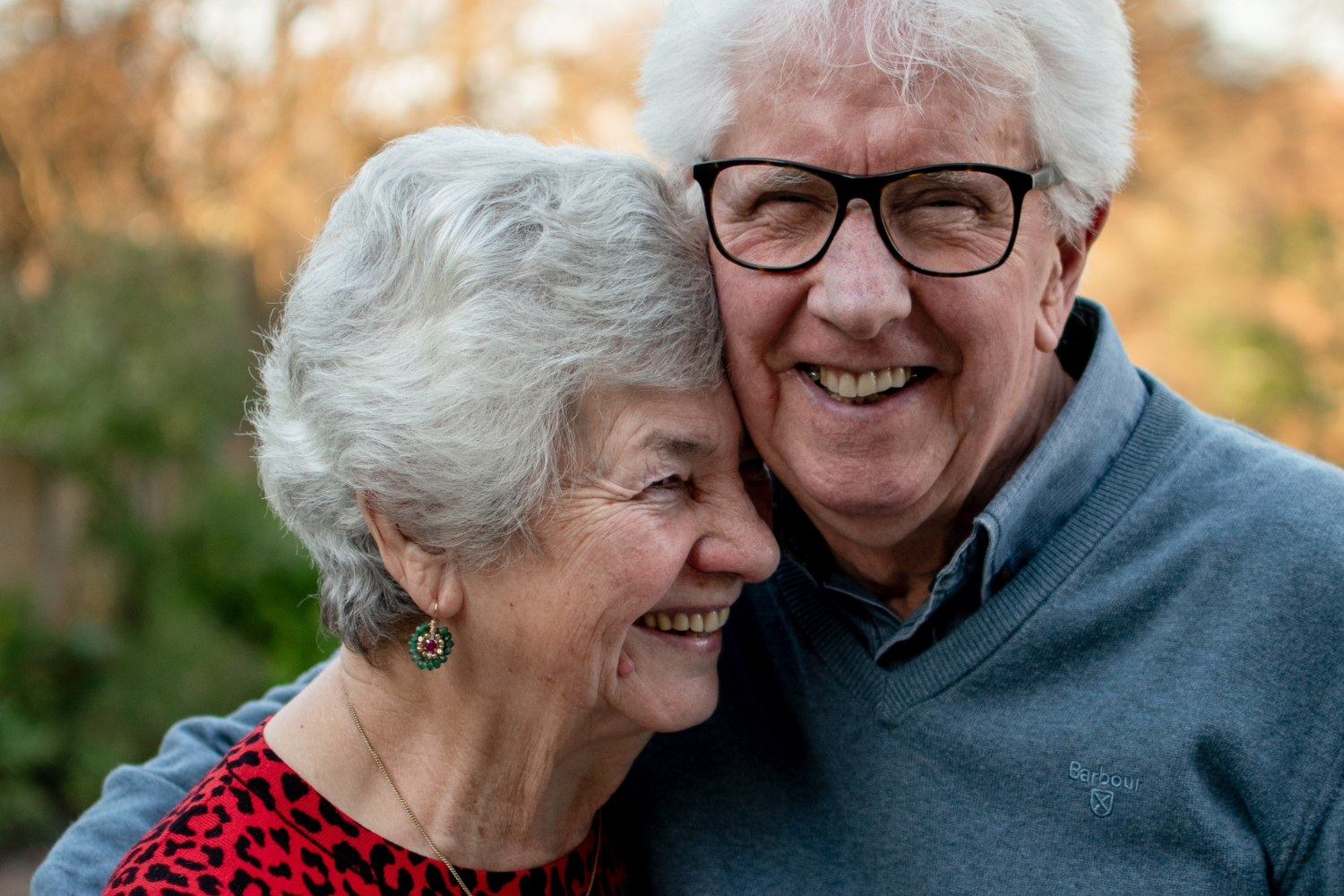 A happy elderly couple embracing