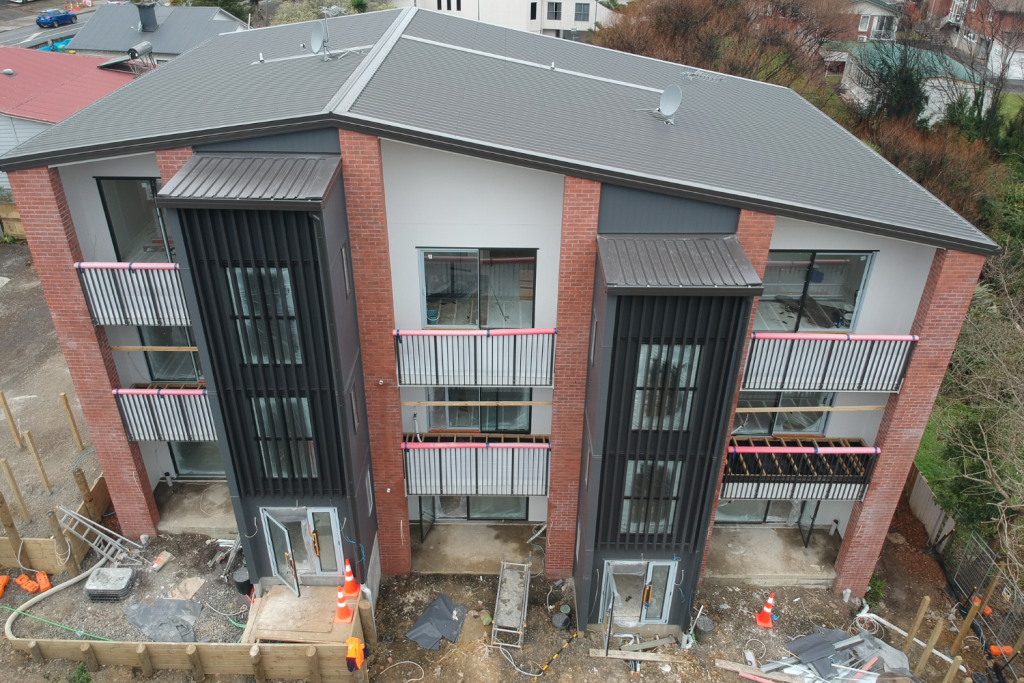 Top-down view of a three-level building construction site