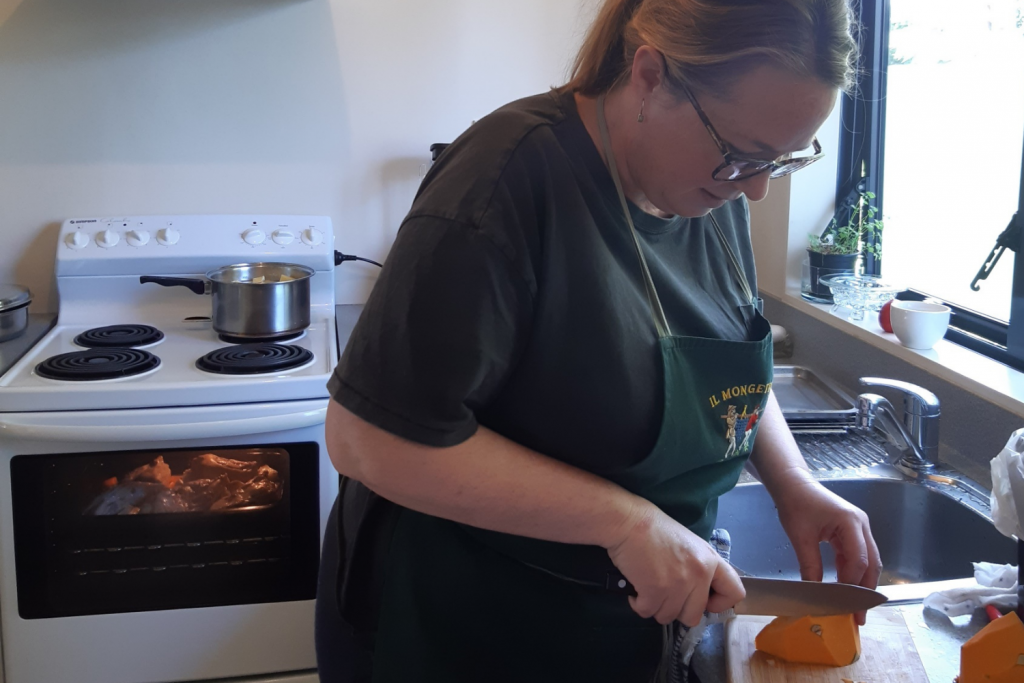 Sally the chef cooking in the kitchen paid for from Pearl's disabilities funding