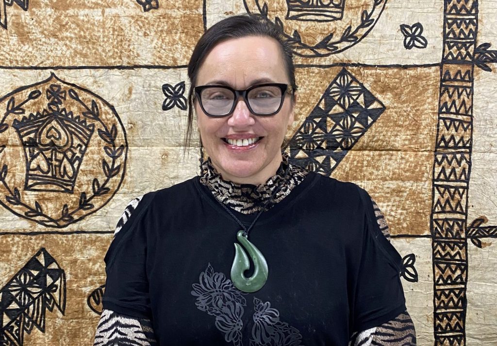 Haahaetu sitting in front of Pasifika Tapestry